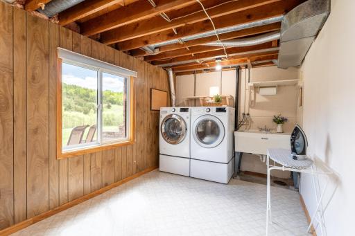 Laundry room dimensions are 14x8 ft. This space is not included in the finished square footage due to unfinished ceiling.