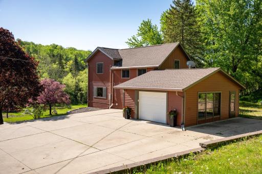 The concrete patio is located at the rear of the home is a great space for grilling!