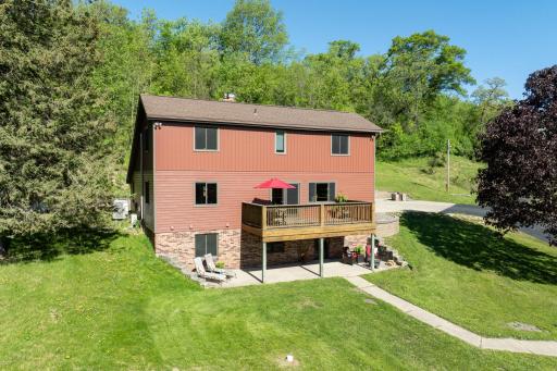 The home features a walk-out lower level to a patio