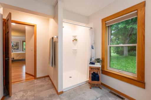 The primary ensuite 3/4 bathroom features an Onyx shower, bidet toilet, vanity with linen storage cabinet, additional linen closet and new flooring. This bathroom was just completed in 2026!