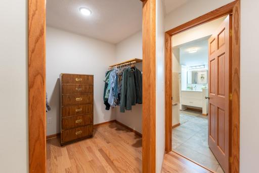 Walk-in closet off primary bedroom. Closet dimensions are 7.75x6.75 ft.