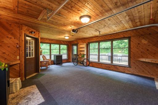 Cedar finishes and bright windows put the attached garage a step above the ordinary.