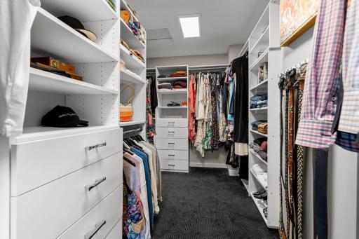 Custom built ins make closet organization easy.