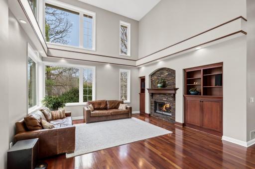 Custom built-ins and cozy fireplace are featured in the living room.