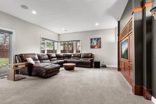 Family room with custom built-in media center - Lower Level
