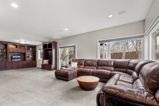 Family room flows into a flex area that can be used as an additional office or playroom. Lower level walks out to large backyard.