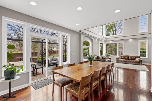 The informal dining area opens up to a large outdoor deck with an automated retractable deck roof.