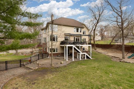 Large deck with automatic commercial-grade retractable full deck roof with gutter system.