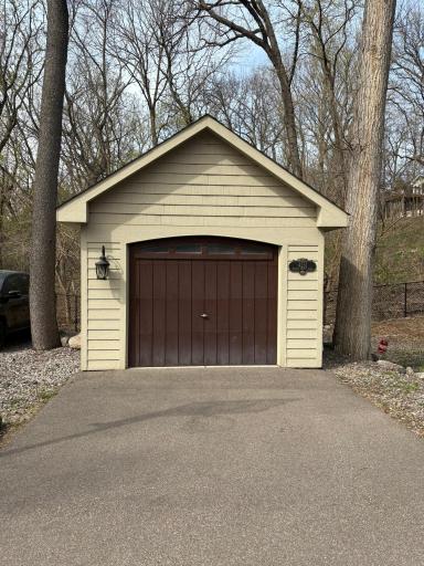 Extra storage garage at the end of the driveway with extra parking.