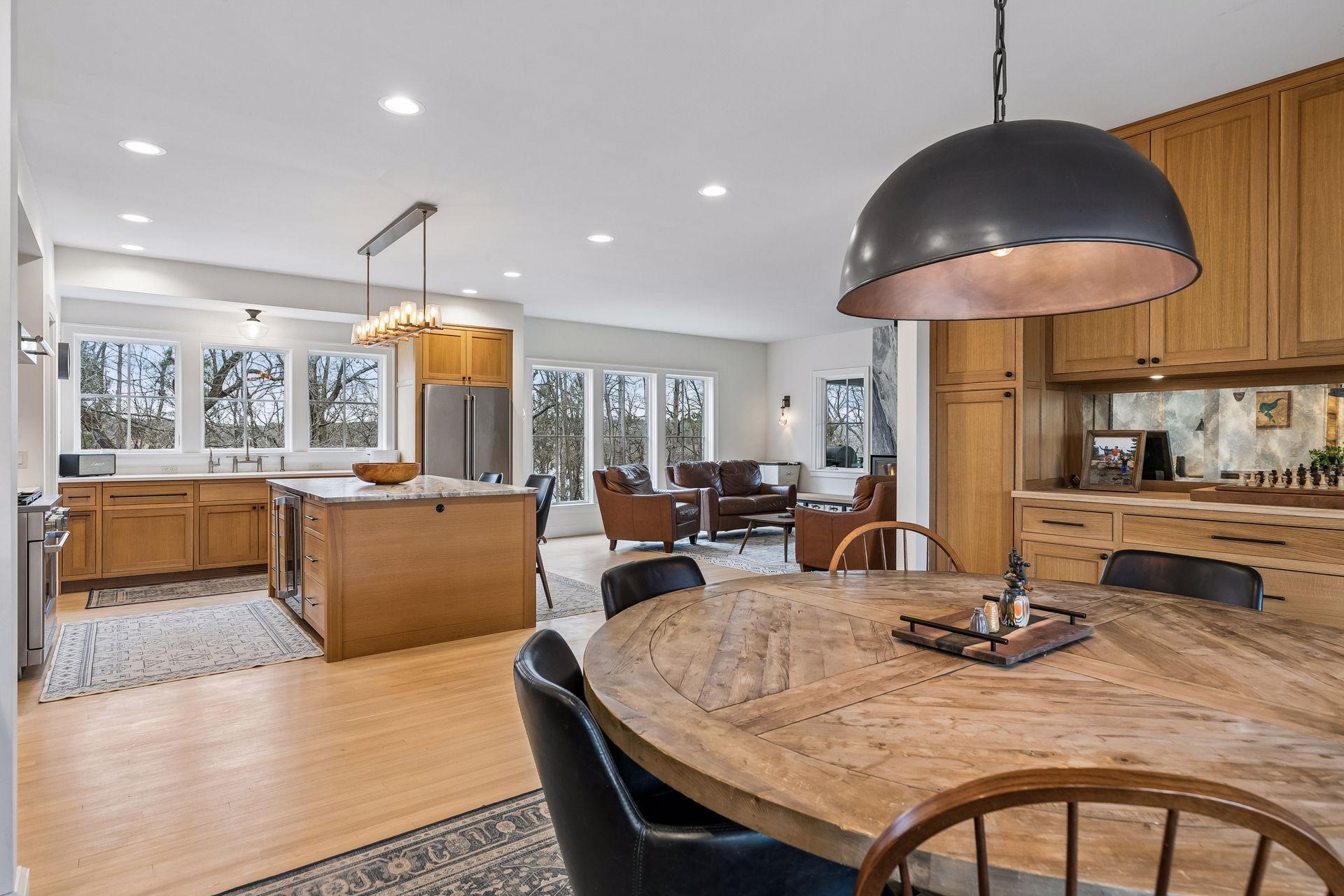 From the dining space, enjoy an expansive view into the open living room and kitchen, designed for both style and functionality.