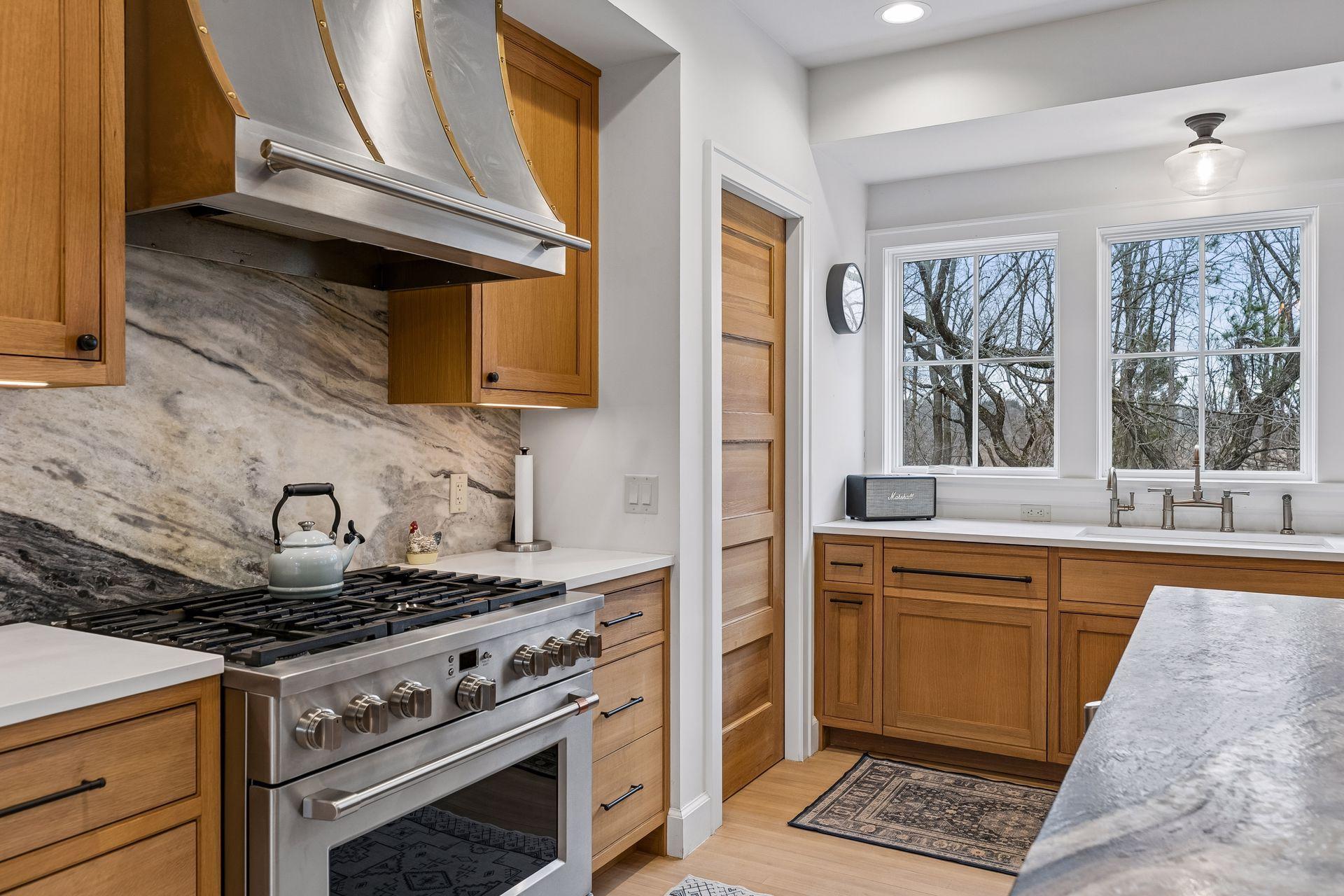 This kitchen offers ample space for culinary creativity and gatherings, with expansive counter space and a well appointed pantry completing the layout.