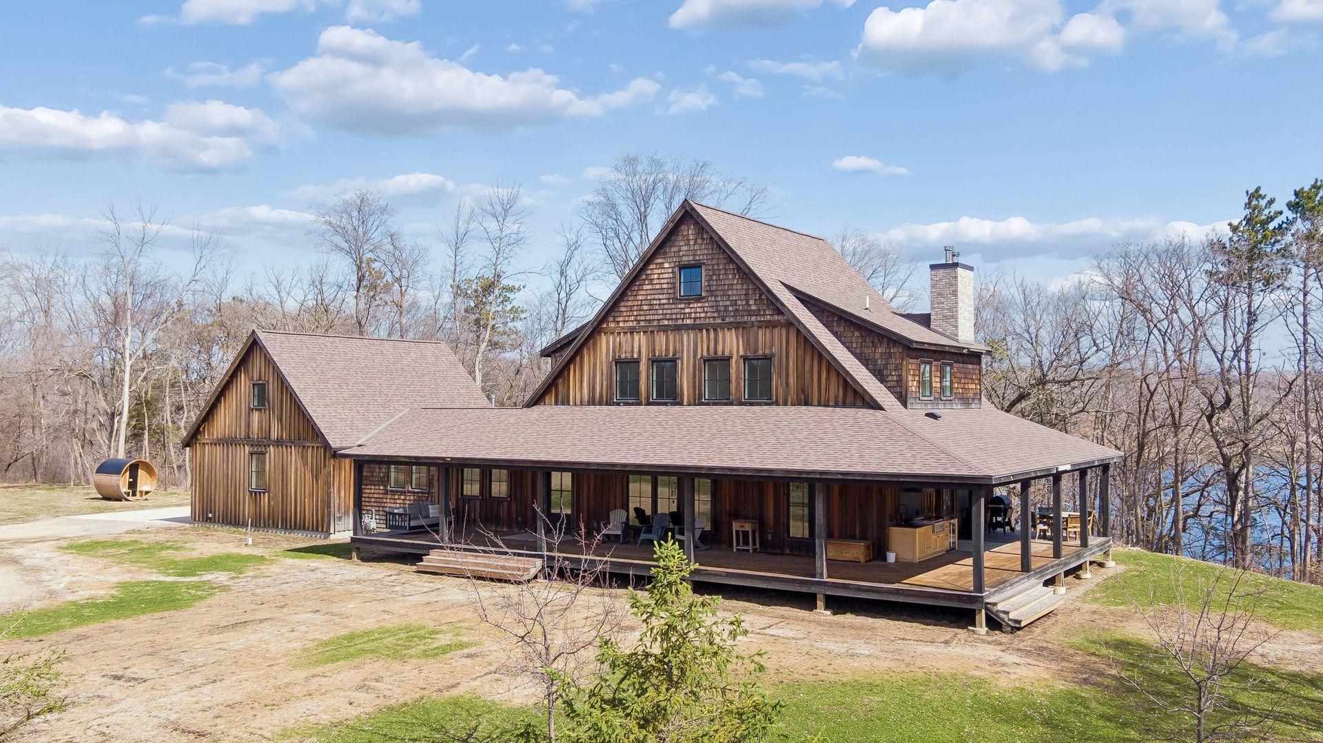 Relax on the stunning covered wrap around deck and immerse yourself in nature; this home’s cedar and pine exterior beautifully harmonizes with the surrounding landscape.