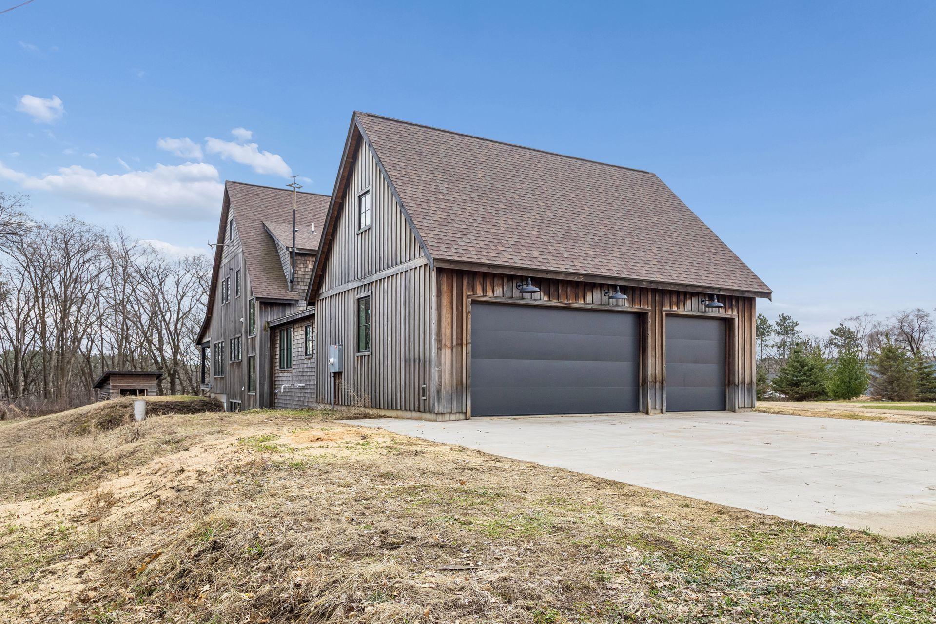 Generous cement parking area directly linked to the garage, providing plenty of room for cars, toys, or guest parking.