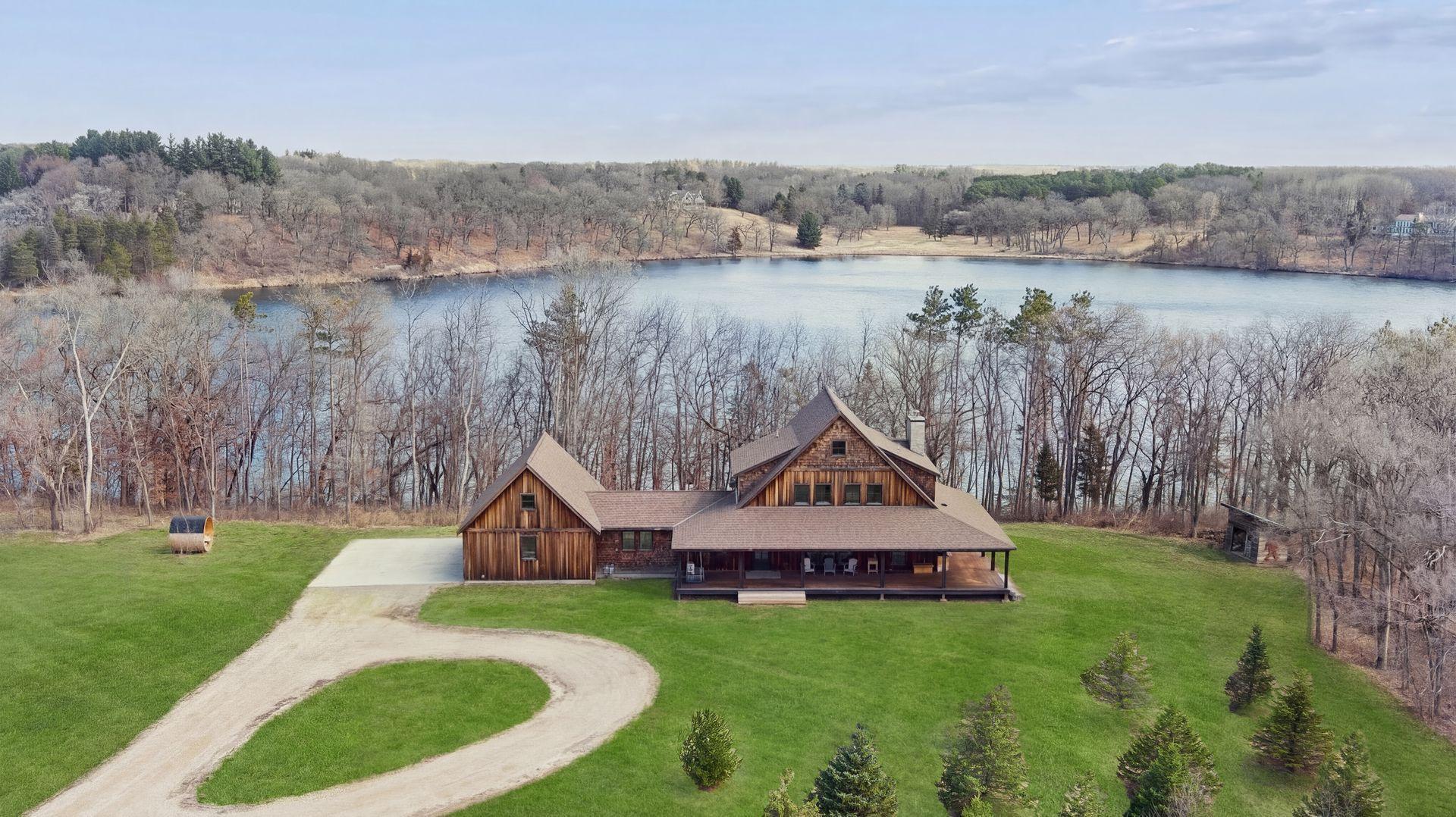 Welcome home to 1085 Lake Edith Lane South! An exceptional lakeshore property on desirable Lake Edith with stunning waterfront views. photo edited to make the grass greener