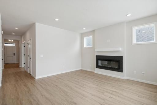 The Kendall offers a seamless flow into the gathering room with sleek electric fireplace for the cozy evenings.