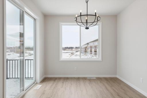 The informal dining room steps right out to the low maintenance deck. Great for the summer grilling!