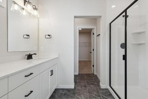 Walk-in shower with ceramic tile walls for a clean, modern look.