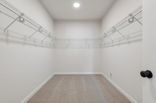 Expansive walk-in closet perfect for organizing wardrobes and seasonal items.