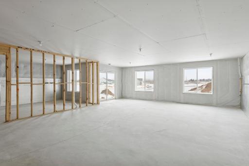 Expansive unfinished walkout basement with endless possibilities for a home theater, gym, or additional living areas.