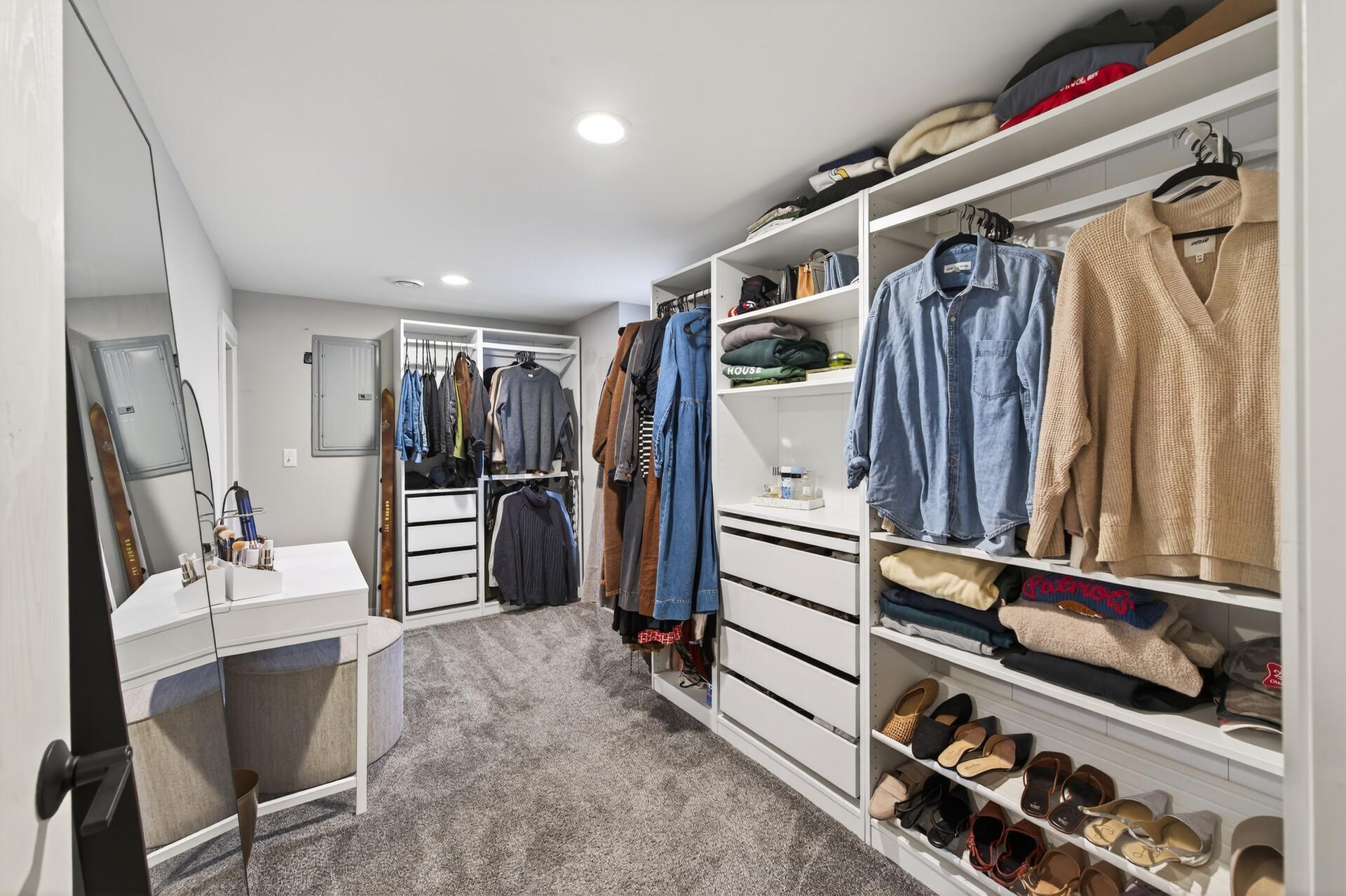 3rd bedroom in the lower level, currently used as a walk-in closet.