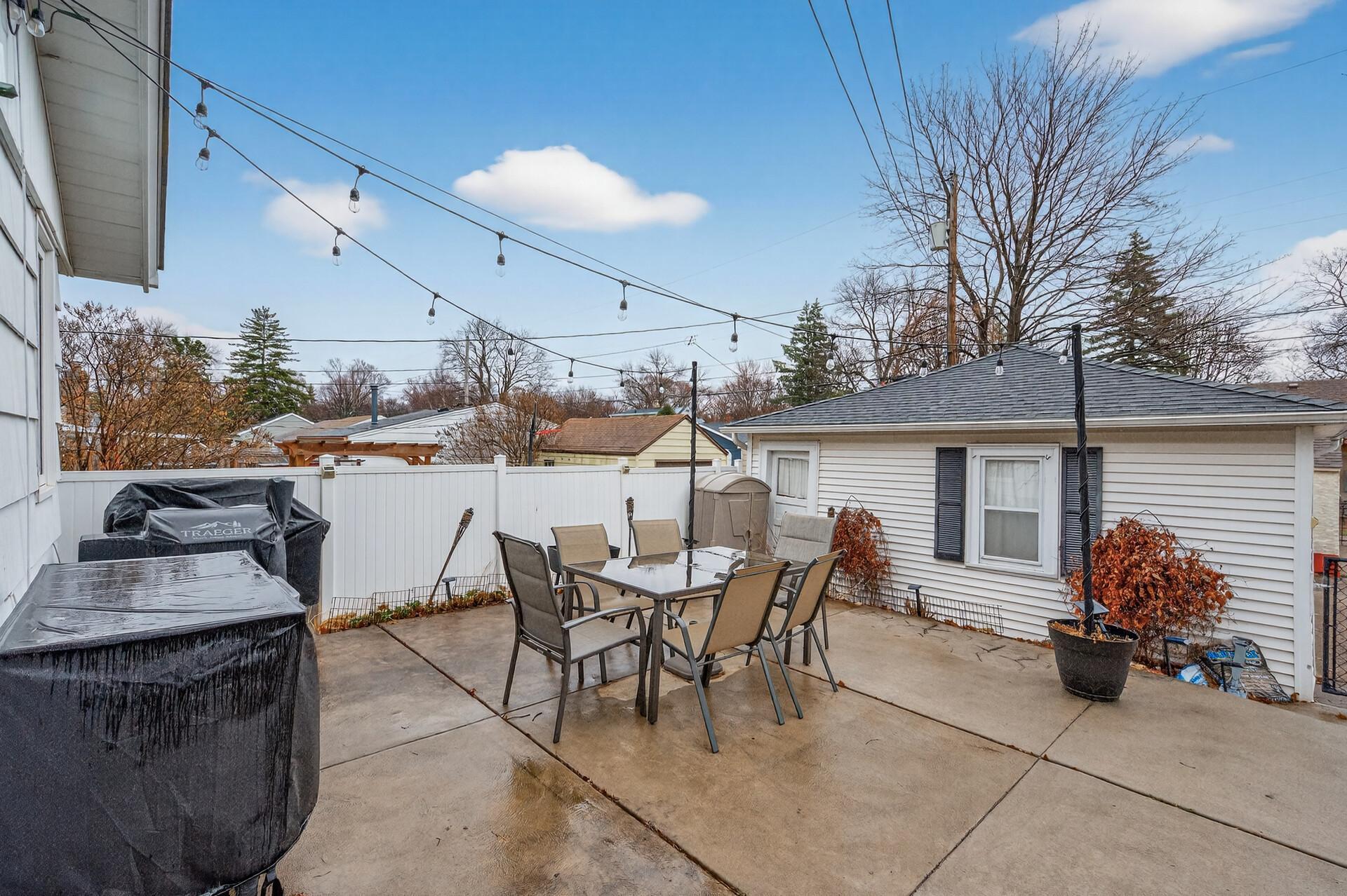 Step out to the rear fenced-in yard with a spacious patio.