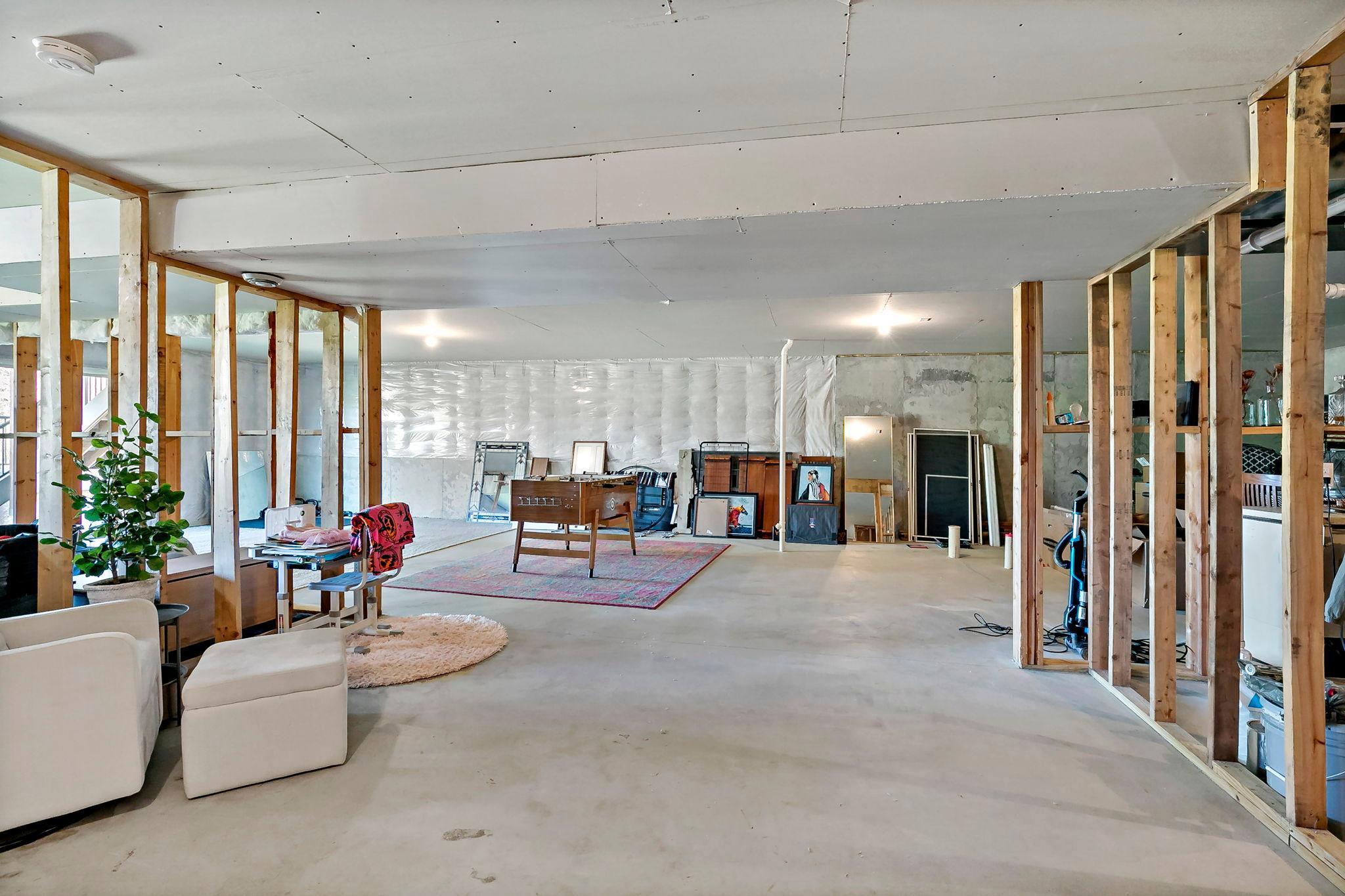 Spacious unfinished basement offering endless potential for customization and additional living space.