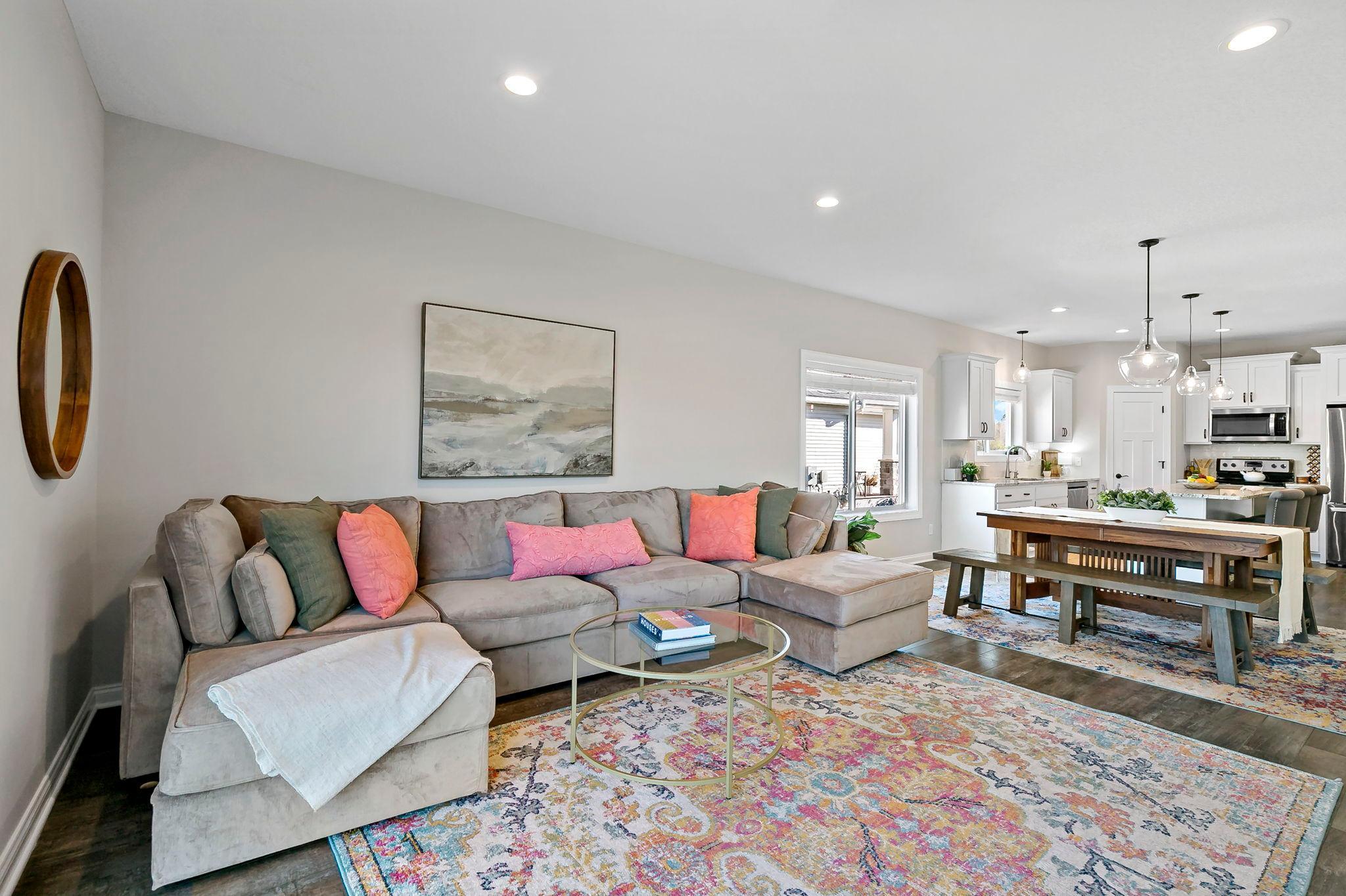 Comfortable open living space with seamless flow to the kitchen and dining area.