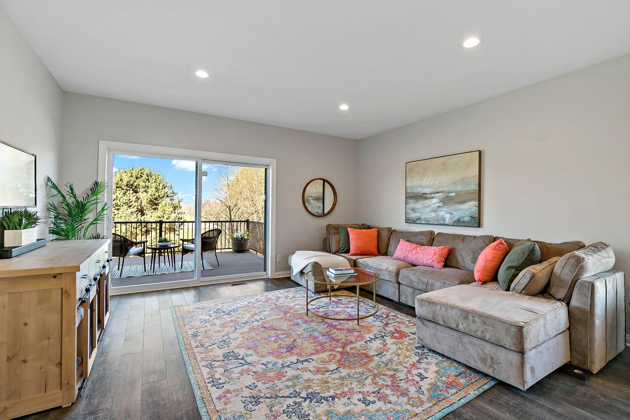 Bright open-concept kitchen and dining space with contemporary lighting.
