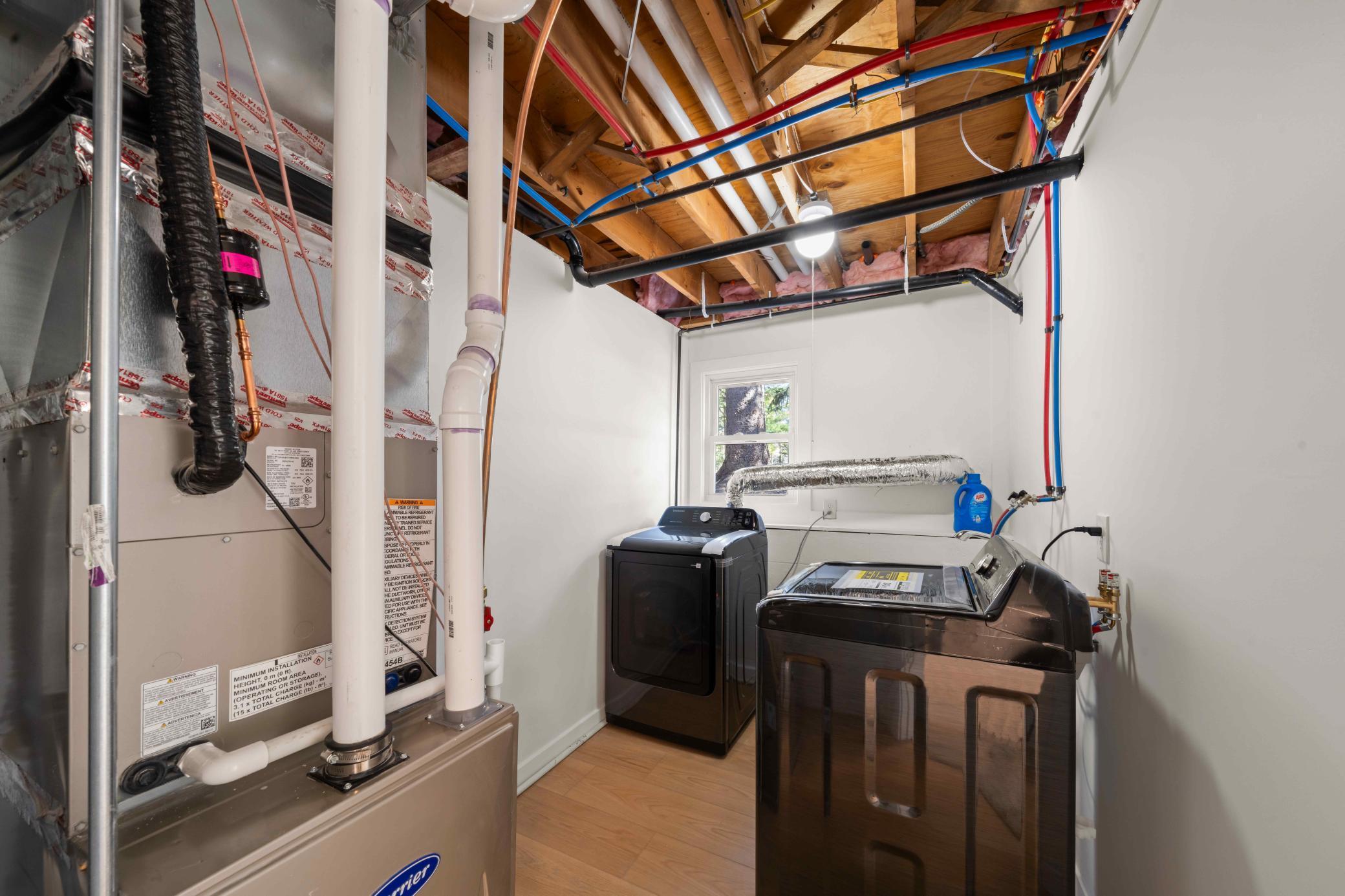 Laundry room with new washer and new dryer - lower level