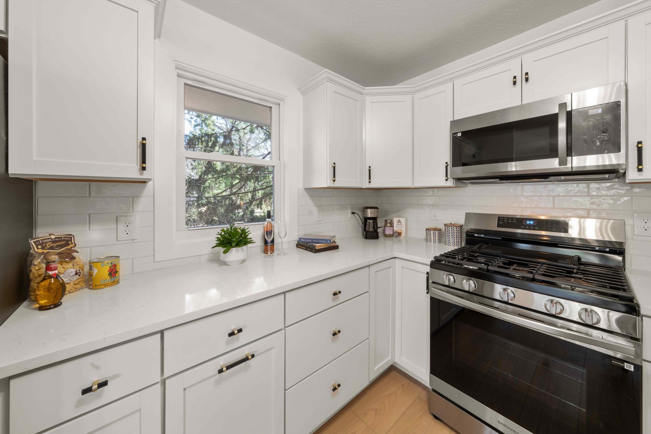 Granite countertops and kitchen window for extra brightness