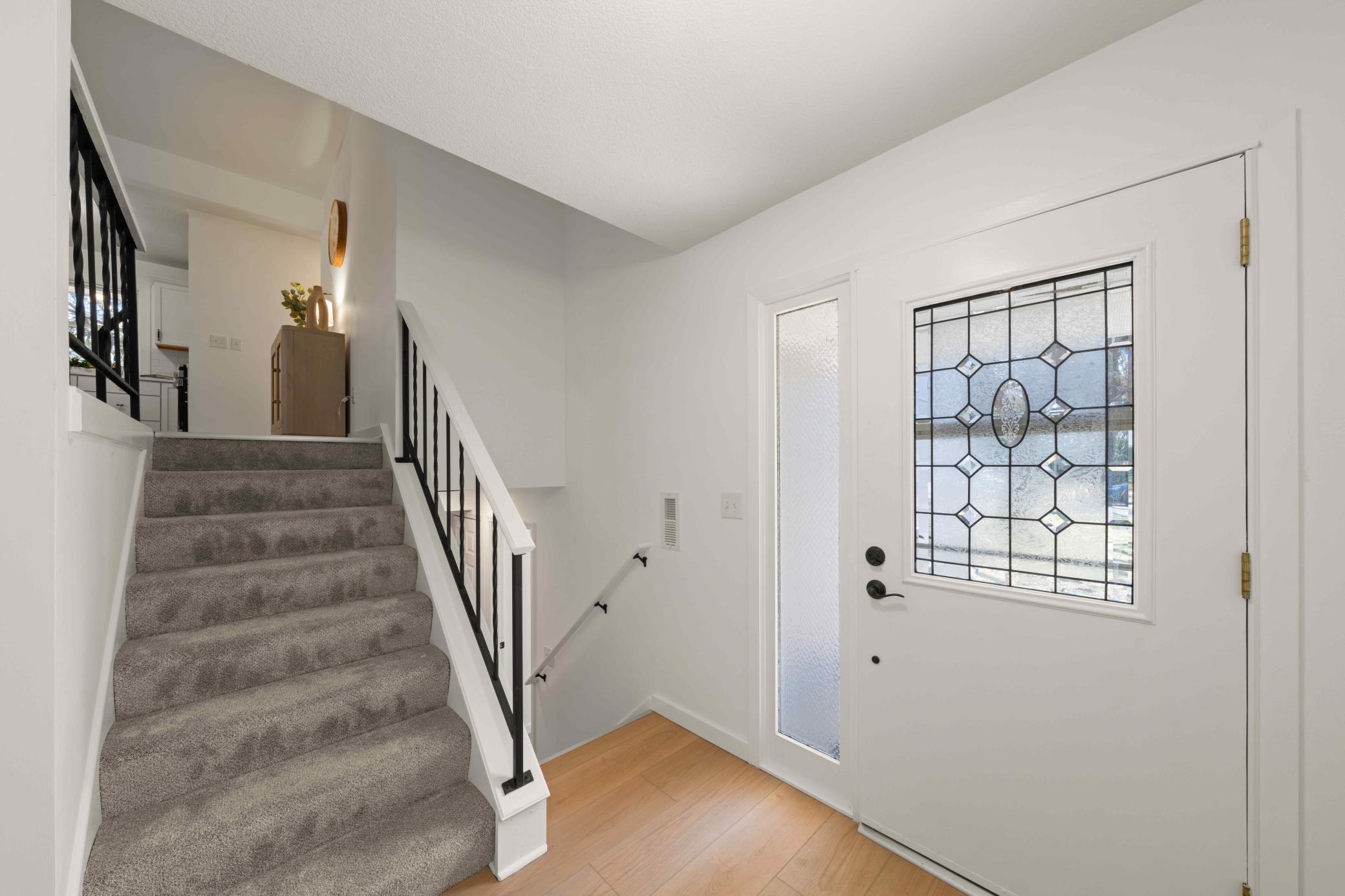 Generous sized foyer with big coat closet and attached garage access door