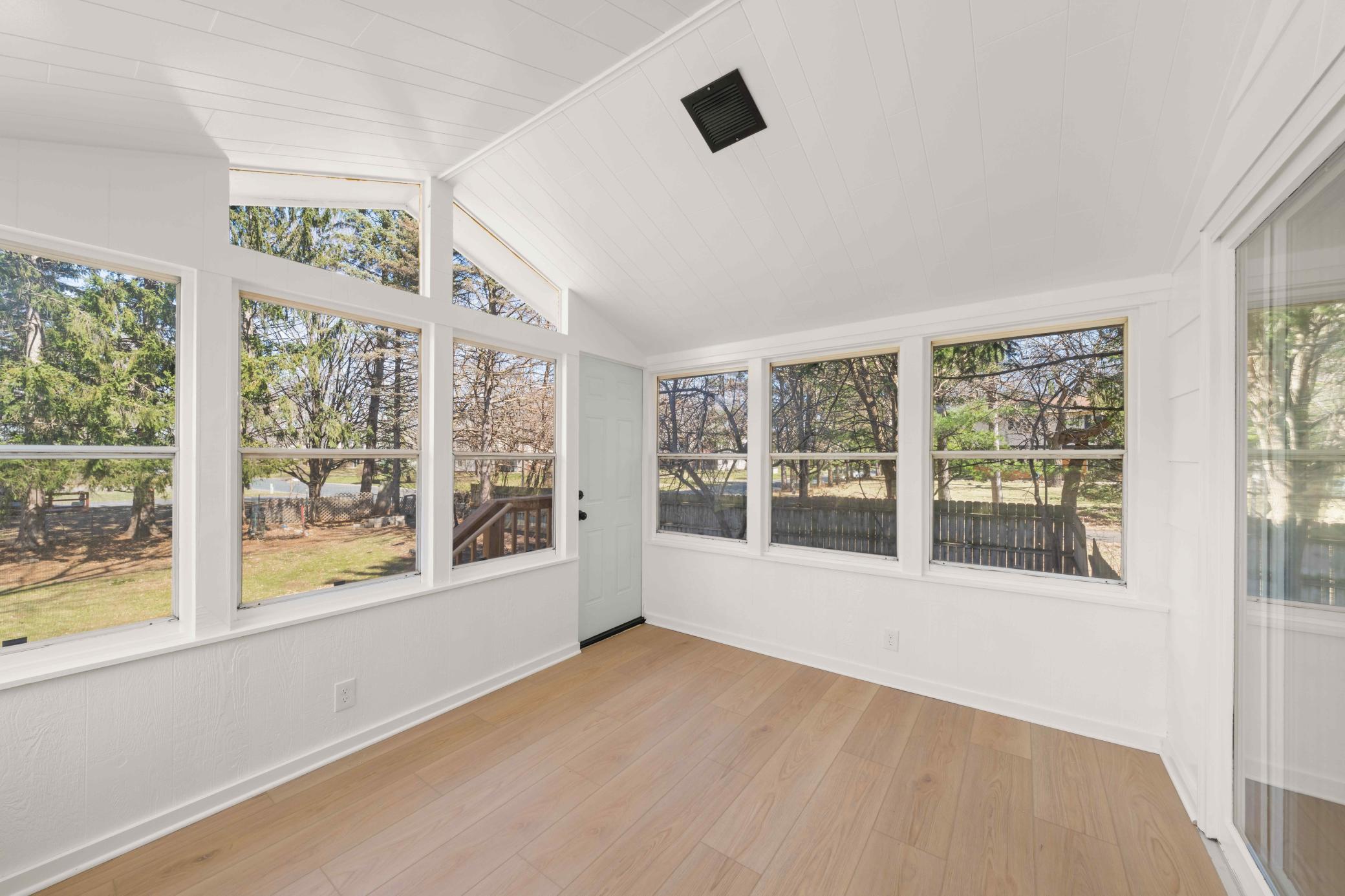 Enjoy access to your fenced in backyard through your 3 season porch