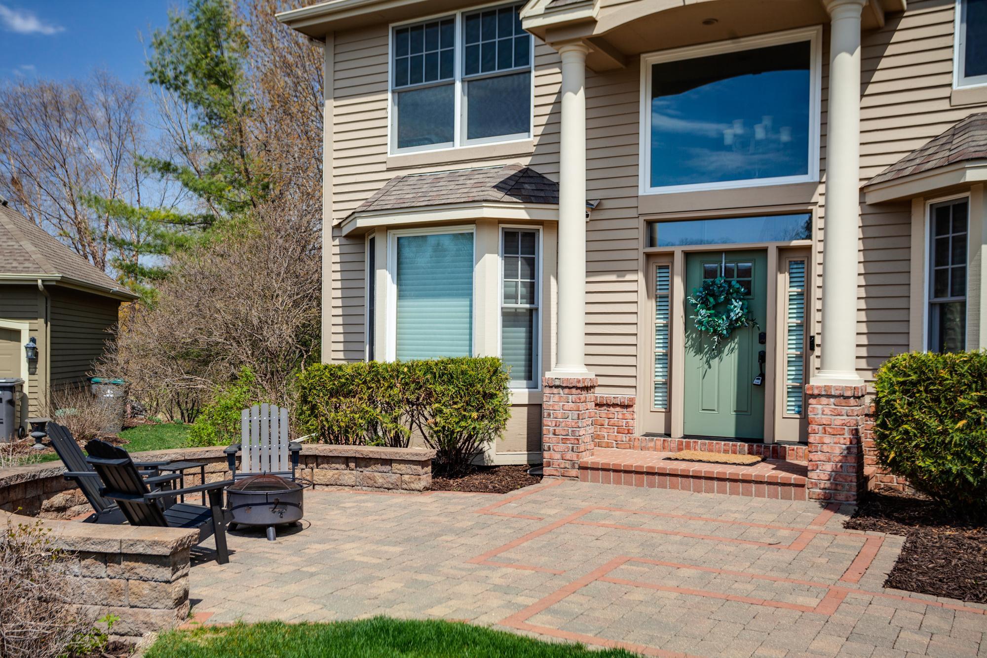 Oversized paver patio area at the front of the home is ready to welcome all guests and the perfect spot to visit with neighbors. New roof installed May of 2026!