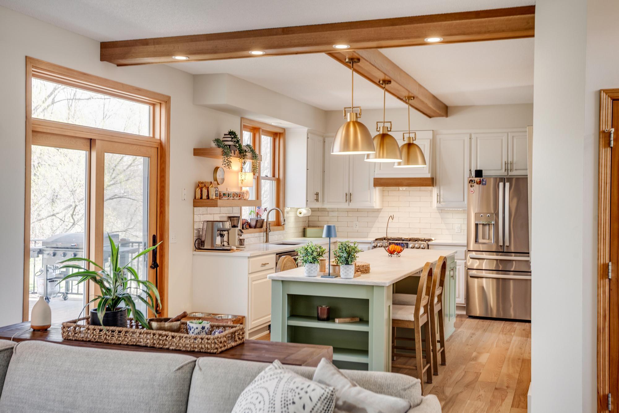 Completely renovated in 2025, the kitchen showcases a stunning blend of style and function + steps directly out to the spacious maintenance free deck creating an indoor/outdoor living experience.
