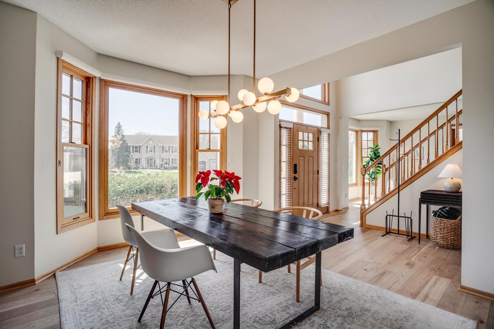 The formal dining room creates an excellent first impression + easily connects to the kitchen area for effortless entertaining.