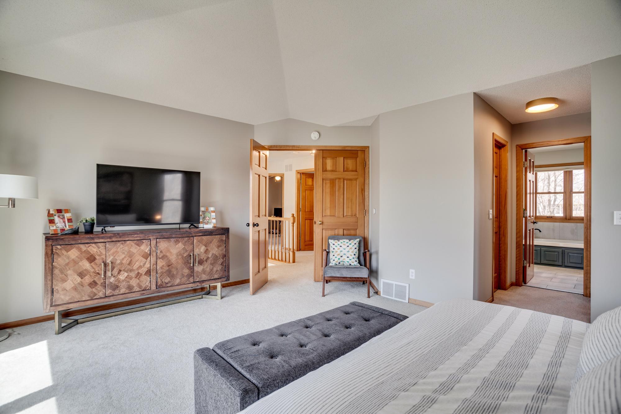 The suite also includes two walk-in closets, a private, en-suite full bath, and fresh paint (found throughout the upper level).