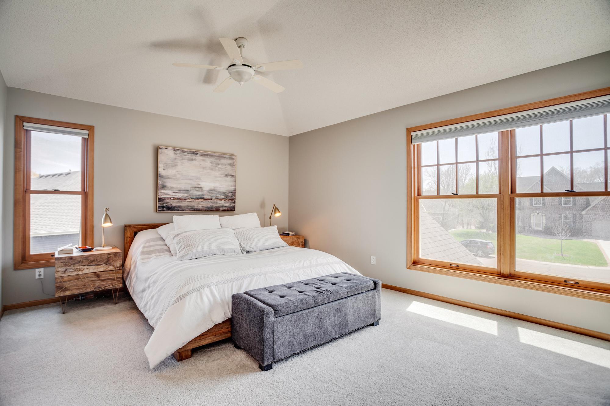 A tranquil retreat, the primary suite features vaulted ceilings, enough space for your largest bed and furniture, and southern exposure for exceptional natural light.