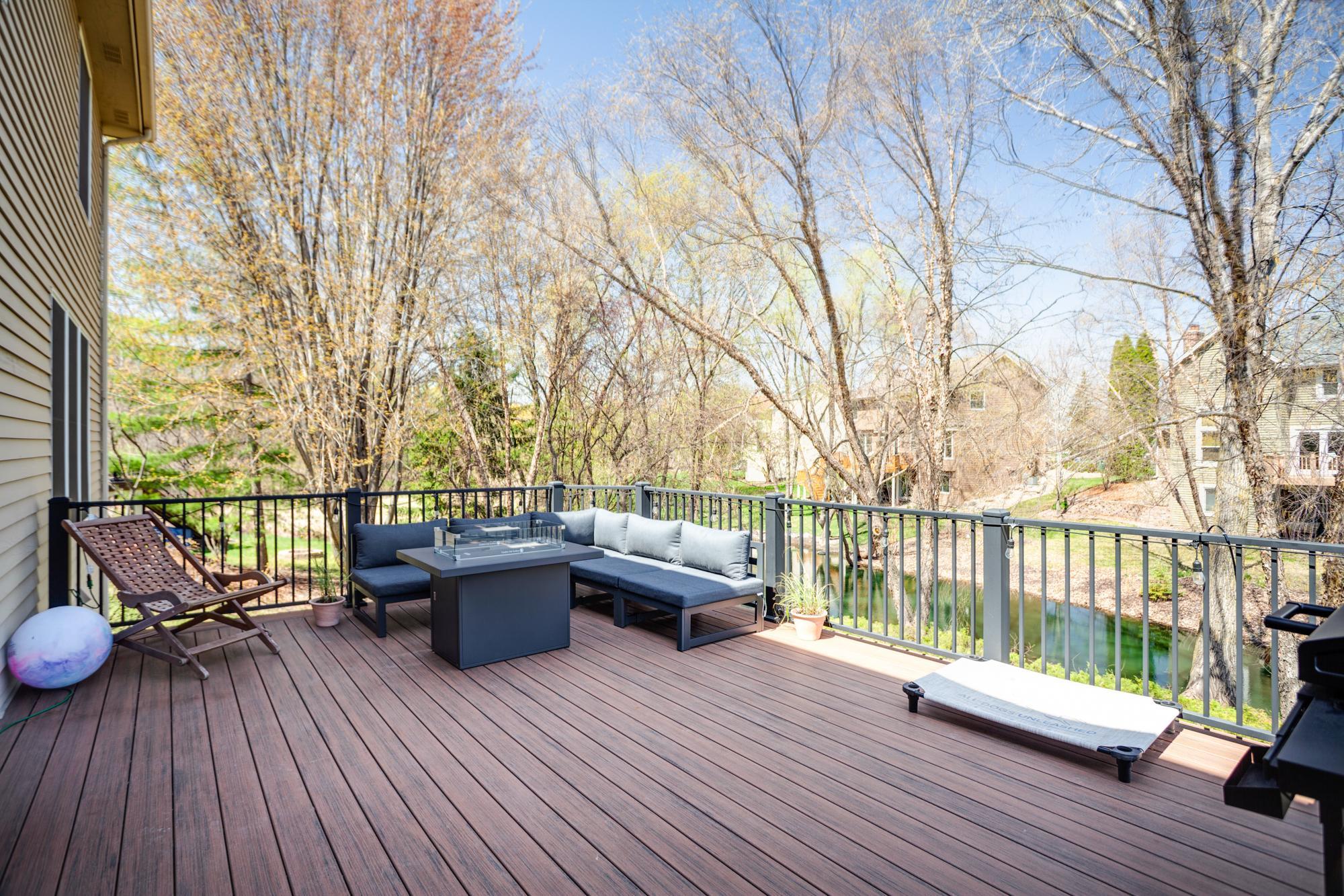 The expansive, maintenance-free deck offers the perfect outdoor retreat with elevated pond views. Plenty of space for lounging, dining, and grilling, in an ideal setting!