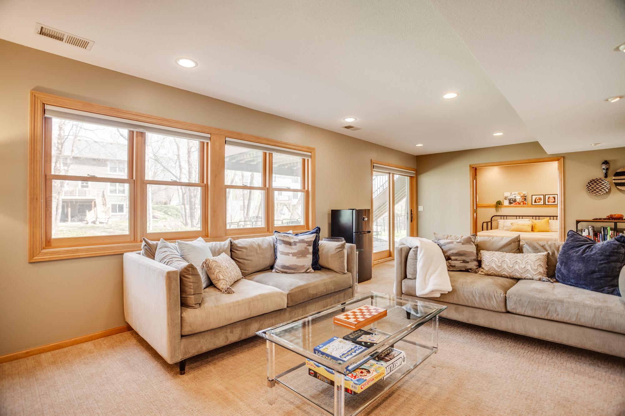 With direct access to the outdoor patio, it seamlessly extends your living space while also connecting to an adjacent bedroom—ideal for guests or flexible living needs.