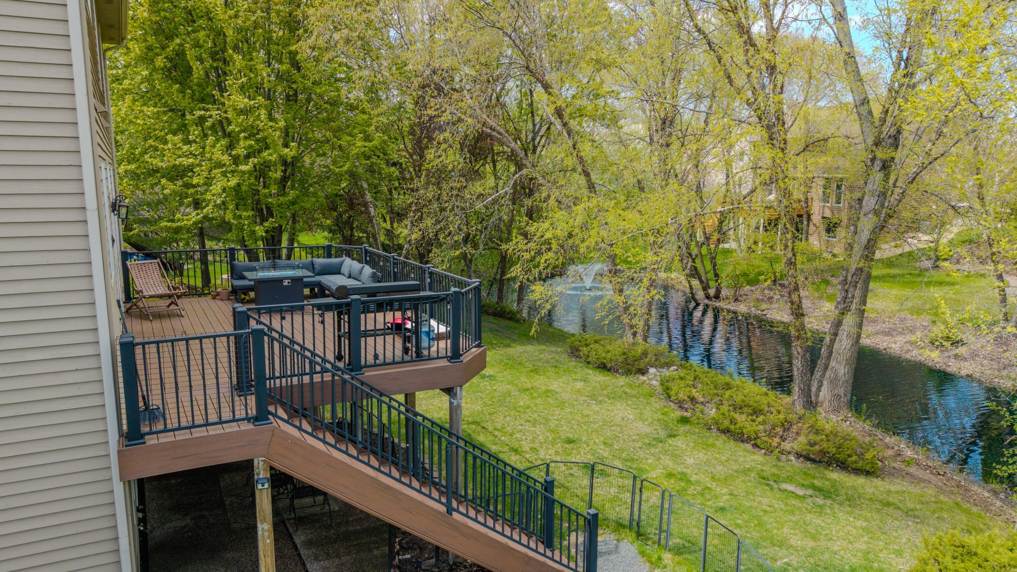 This home backs to and overlooks a tranquil pond setting, offering a scenic, tree-lined backdrop with peaceful water views and added privacy.