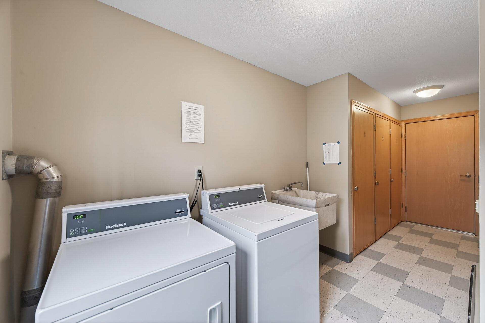 The shared laundry and storage locker room