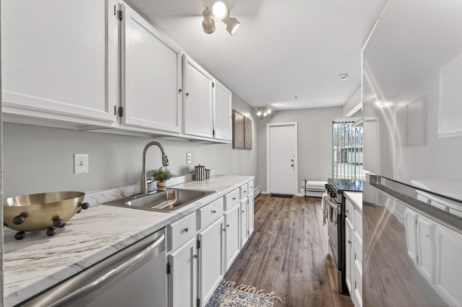 The kitchen has been beautifully refreshed and has new stainless steel appliances