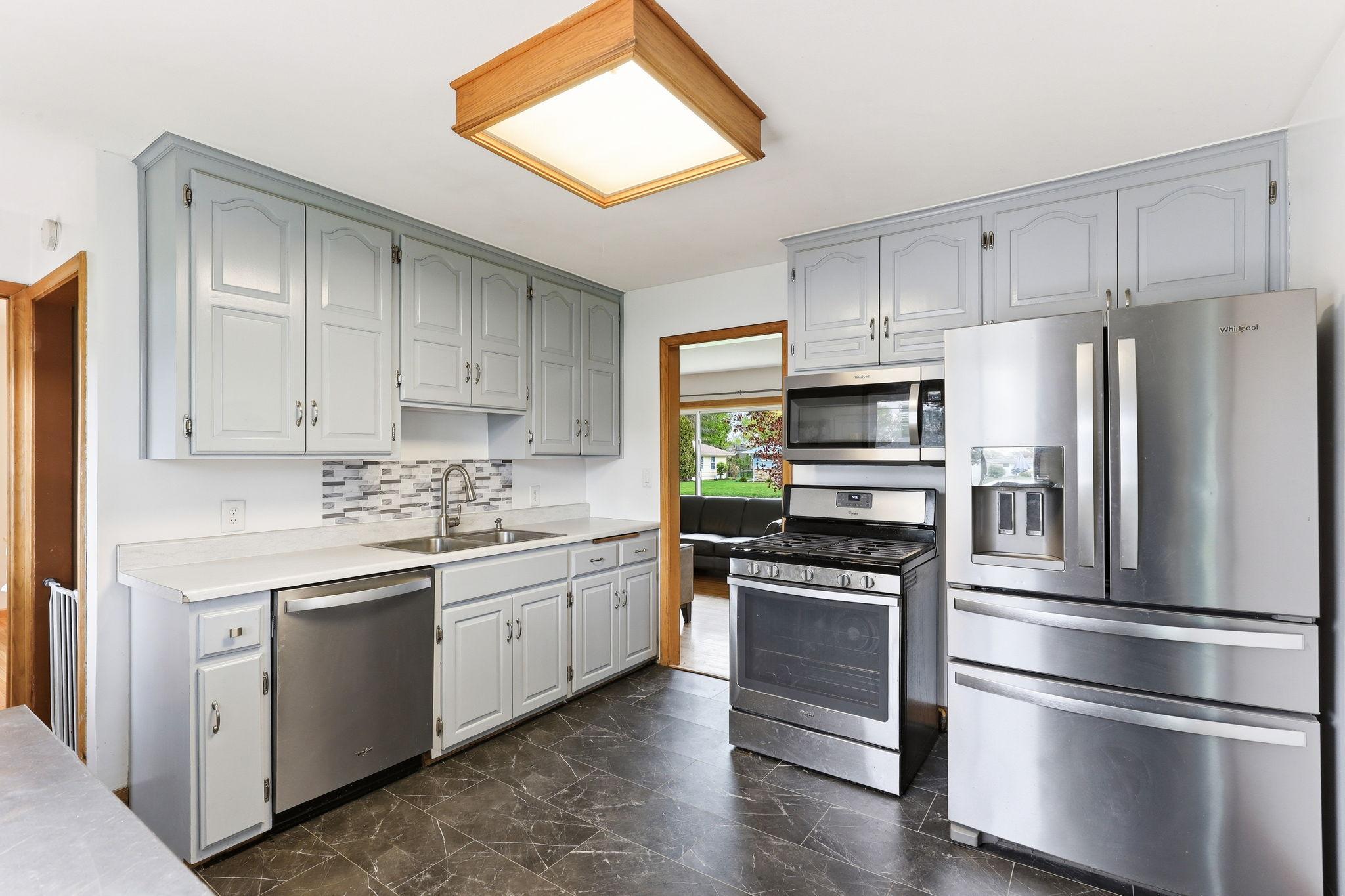 A well-designed kitchen featuring a functional layout and sleek stainless steel appliances.