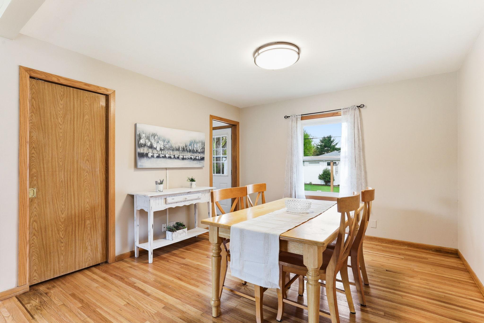 Dining area located off the living room with convenient access to the kitchen, providing an ideal setup for everyday meals and entertaining.
