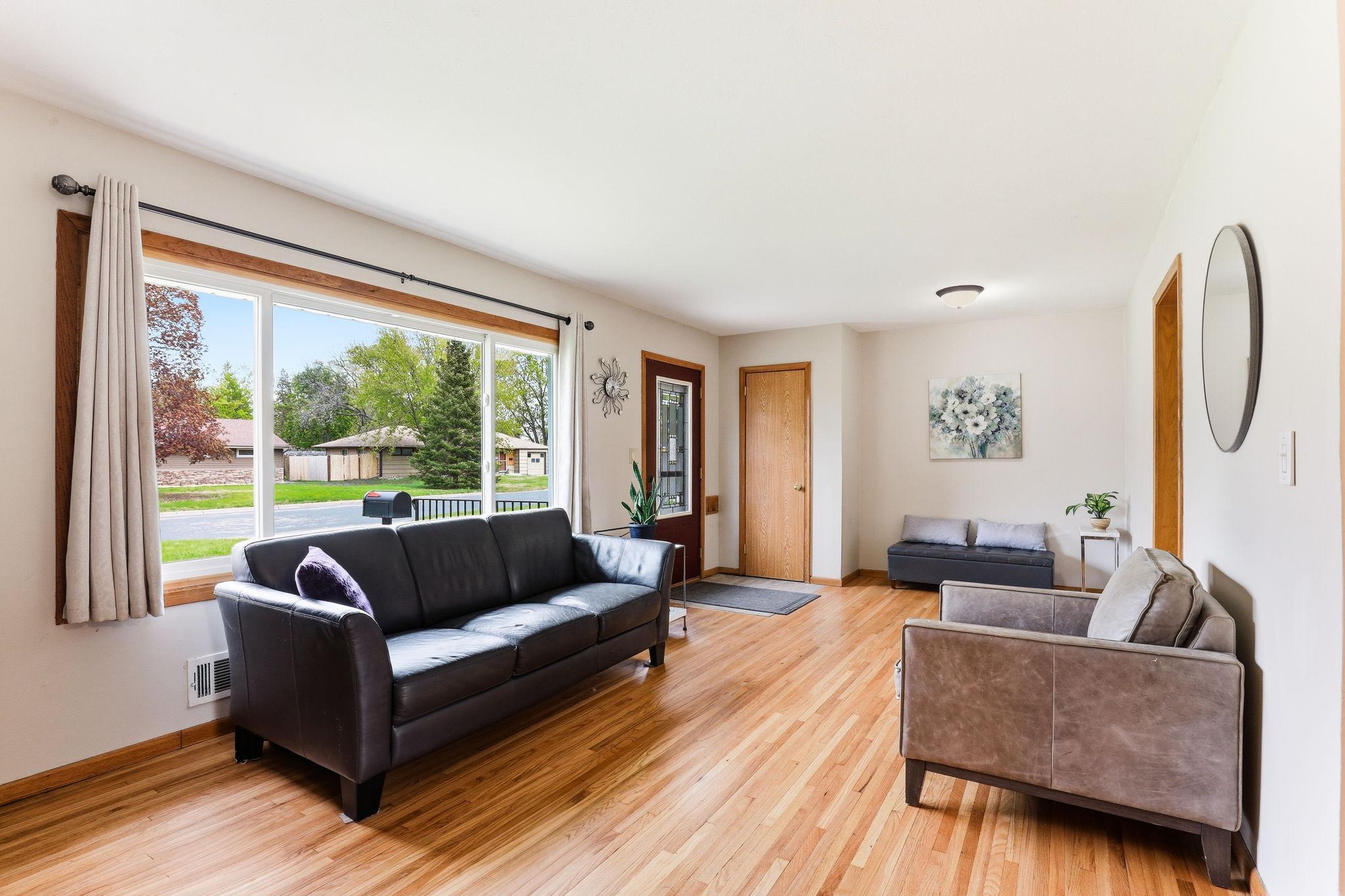 Large picture window offers an abundance of natural light and provides a clear view outside.