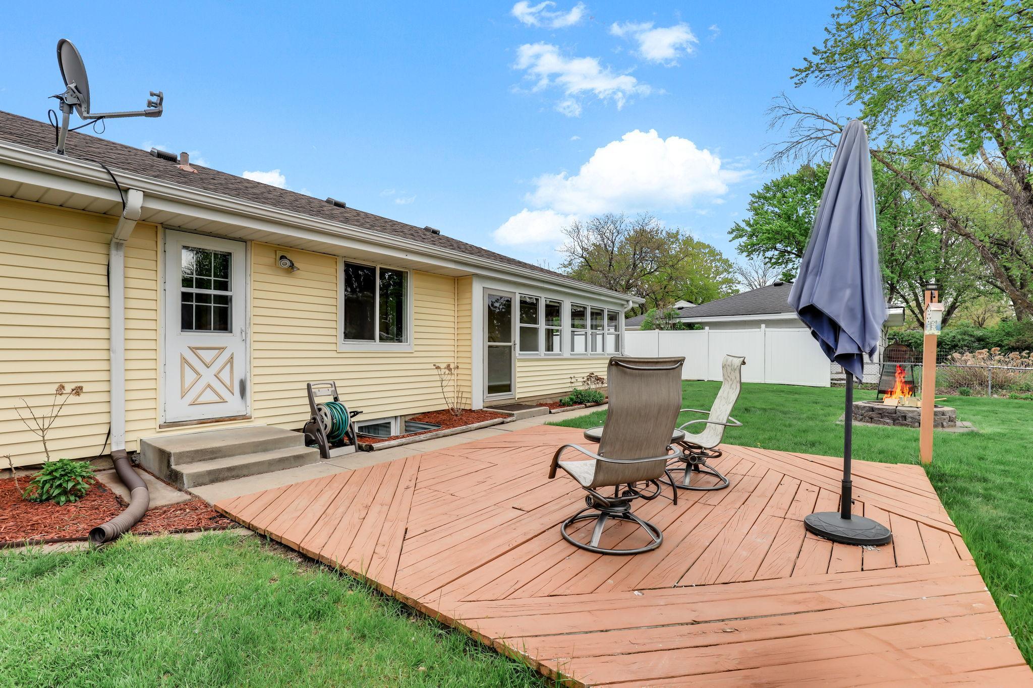A welcoming platform deck that creates a comfortable spot for relaxing or gathering outdoors. Its open layout provides plenty of room for furniture and easy enjoyment of the backyard.