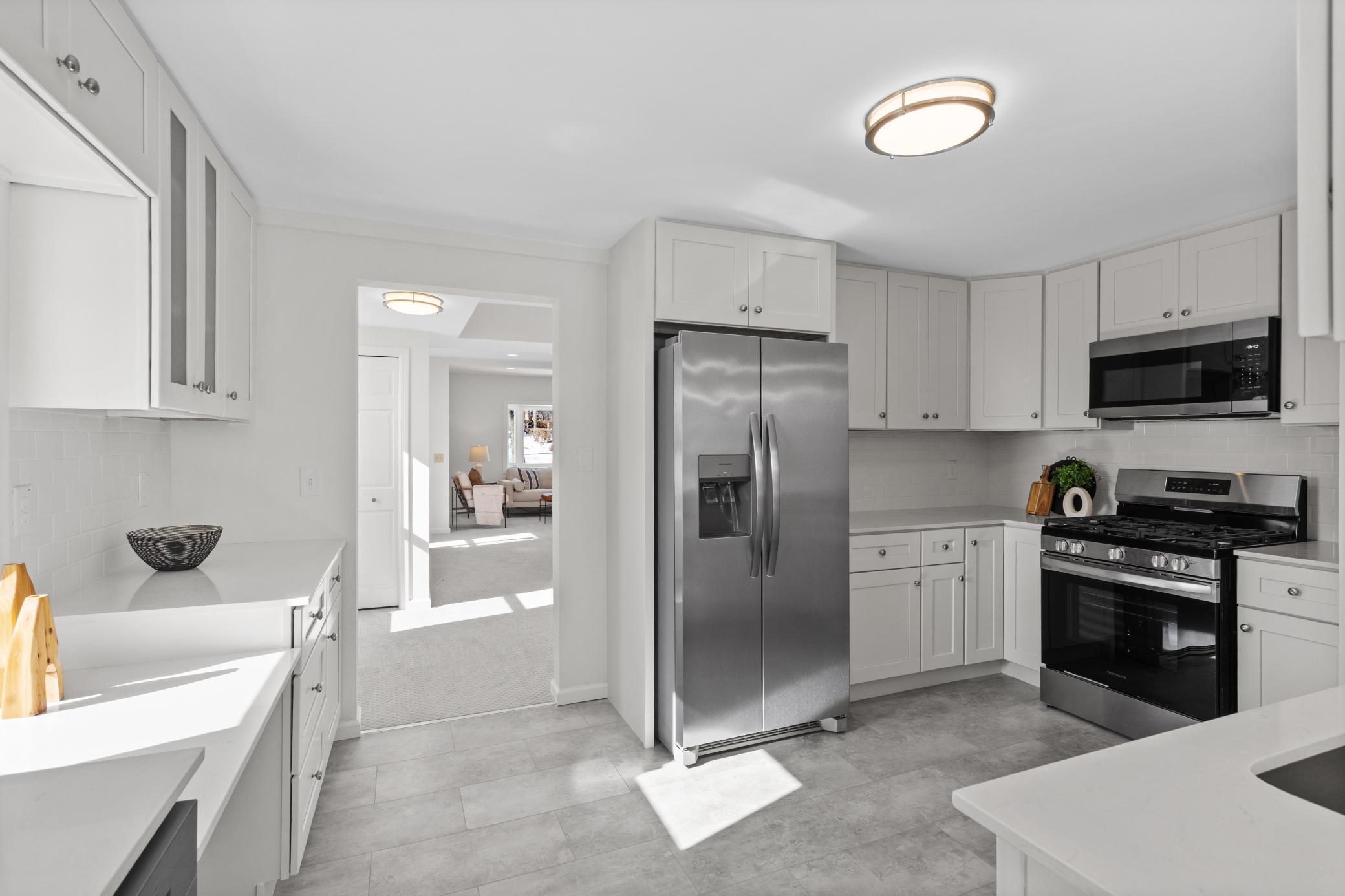 New cabinets, countertops, backsplash, LVT flooring and stainless steel appliances.