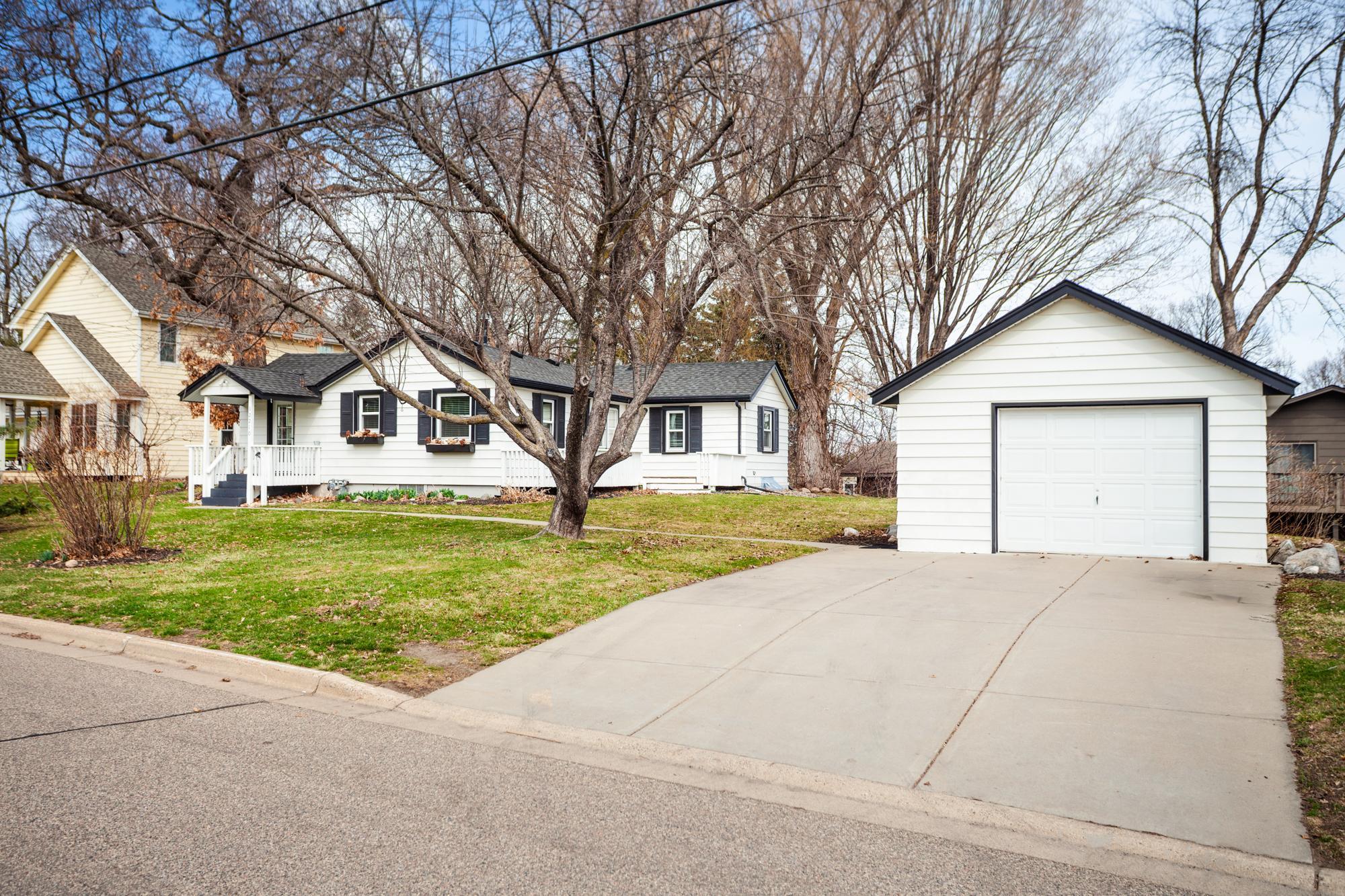 Detached single car garage is clean and oversized (16x22). Spacious concrete drive offers additional space for parking + a concrete walkway leads directly to the covered front porch entry.