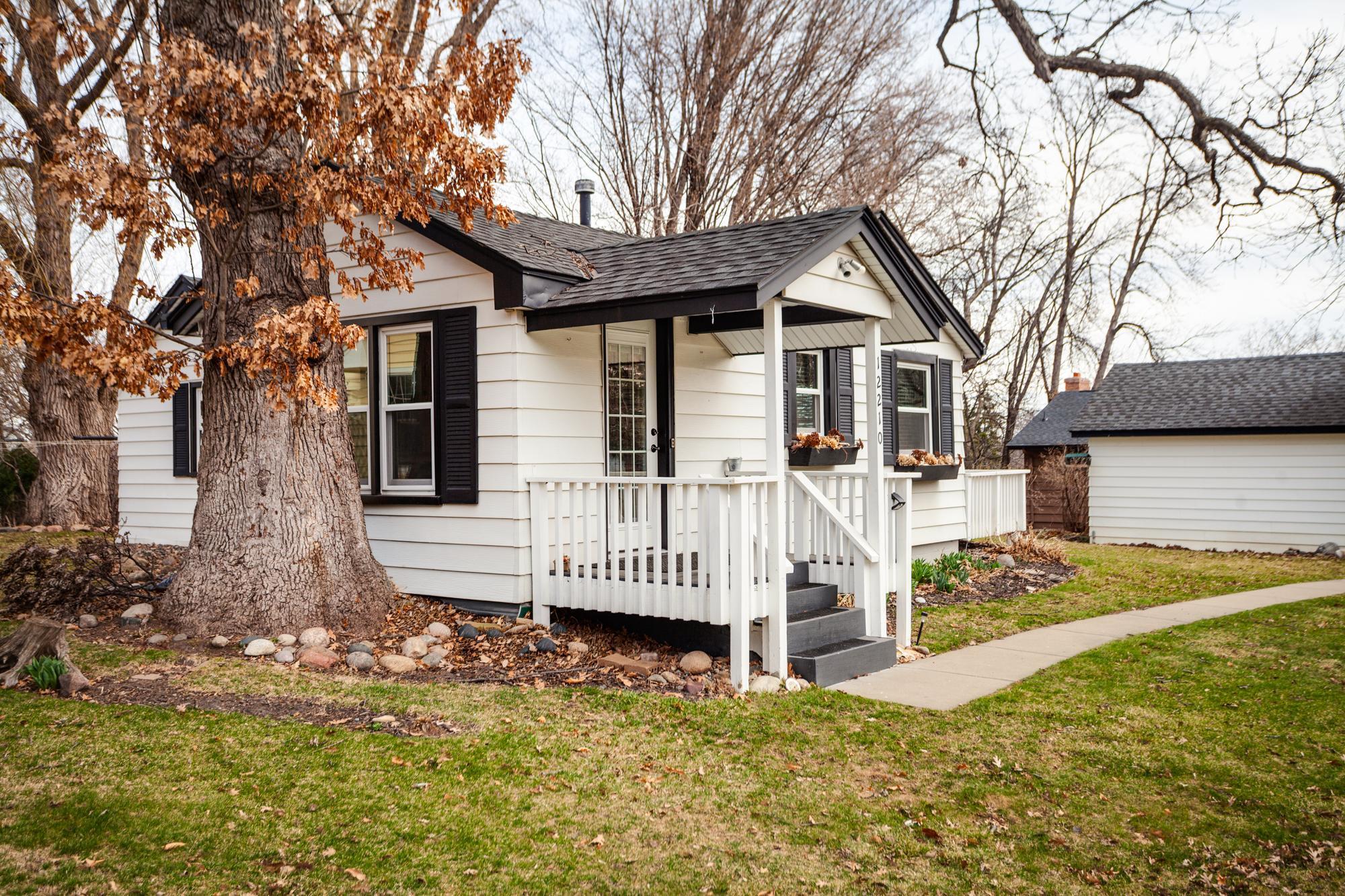 A close-up of the covered front porch which opens effortlessly to the home's kitchen.