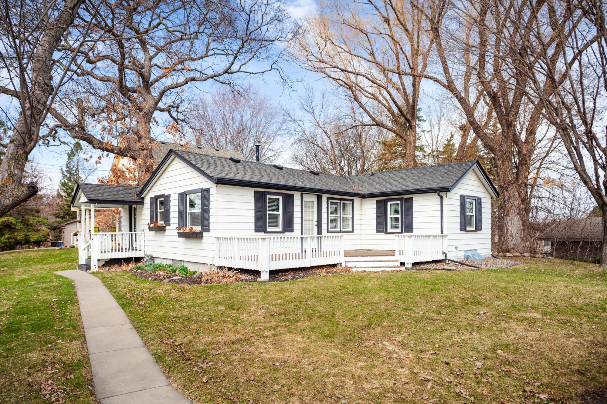 Nestled on nearly a quarter acre, the home is surrounded by open green space and features a large deck for relaxing and entertaining.